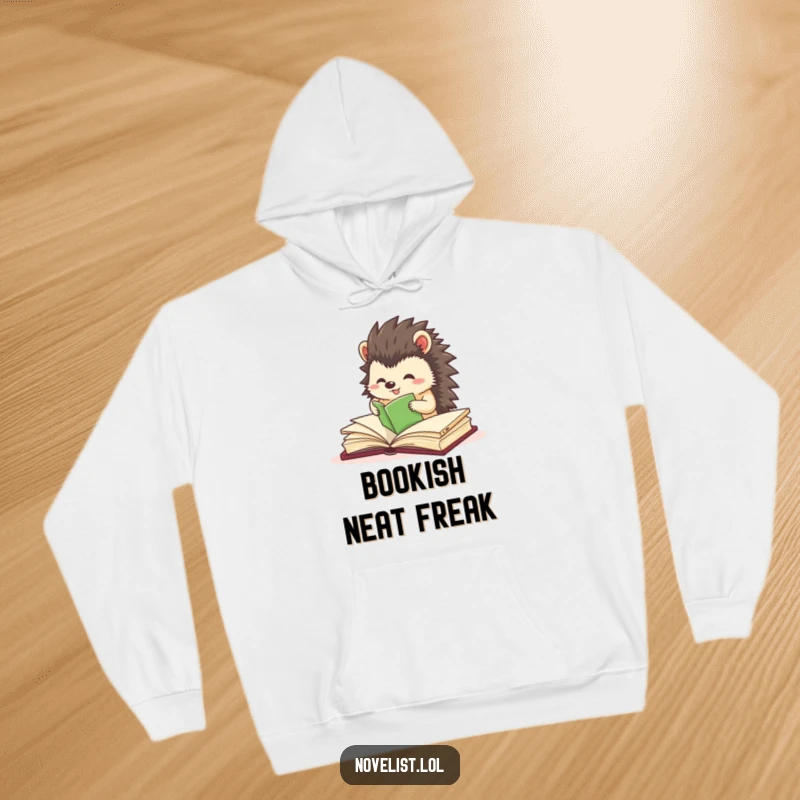 Funny hoodie showcasing a small hedgehog character excitedly and precisely organizing book pages, highlighting neatness.