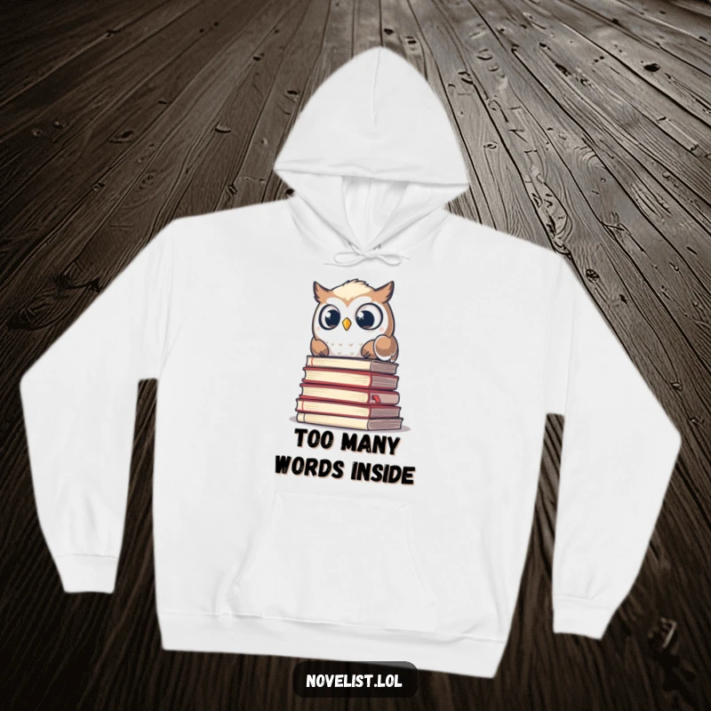 Funny hoodie with a startled owl peeking from behind a large stack of old manuscripts, designed for humor and warmth.